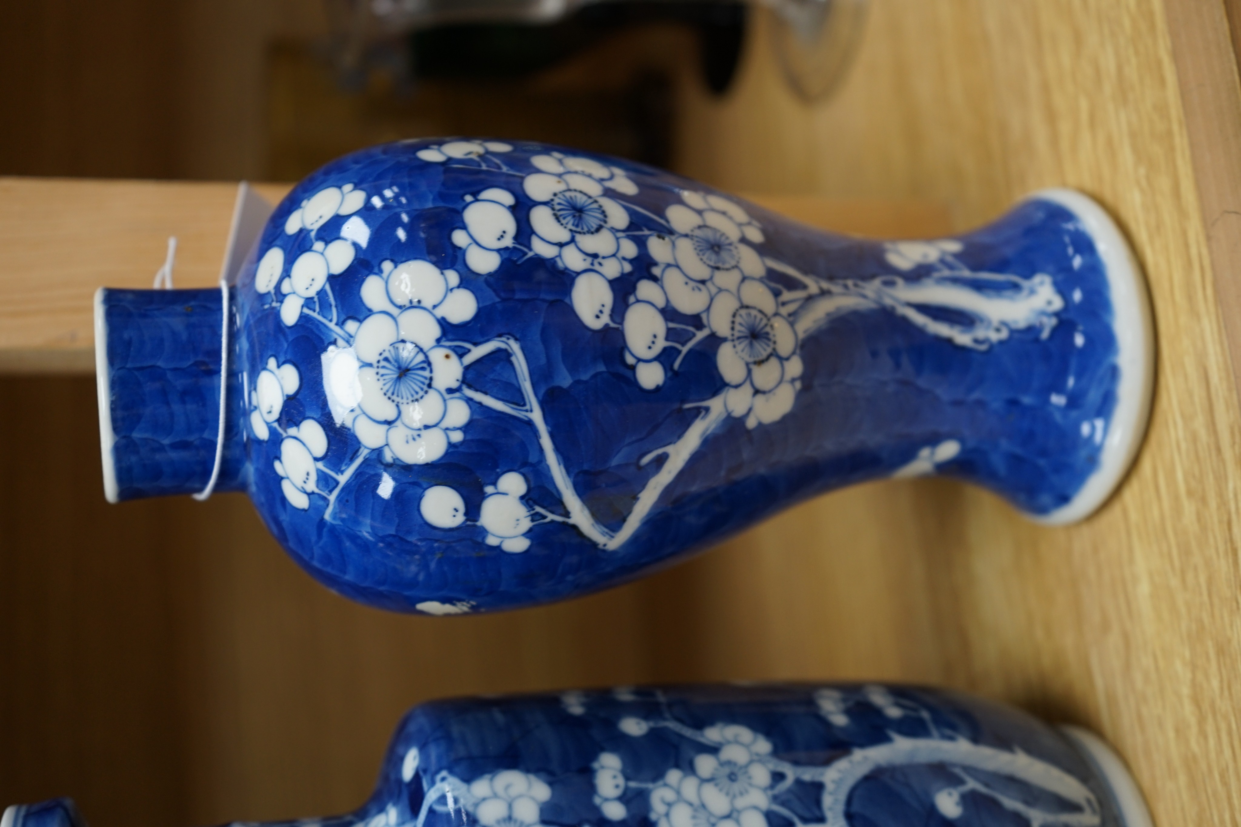 Three Chinese blue and white prunus vases. 25.5cm